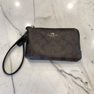 COACH two zippered pocket brown wristlet, leather, insignia.